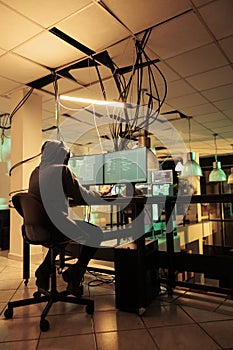 Cyberattack, hacker running malware code on computer, hacking database