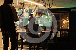 Cyberattack, hackers running spyware code on computer screen