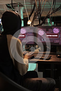 Cyberattack, system hacked warning on screen, computer security technology