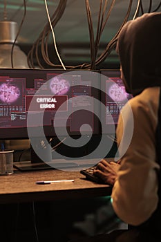 Cyberattack warning on computer screen, hacker stealing data