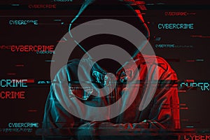 Cybercrime concept with faceless hooded male person