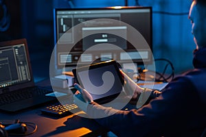 hacker using tablet pc computer for cyber attack