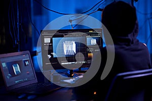 programmer working with 3d graphics on computer