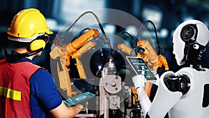 Cybernated industry robot and human worker working together in future factory