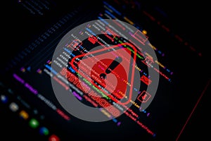 Cybersecurity breach warning with red alert symbol and System Hacked text over programming code, representing hacking,