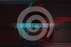 Cybersecurity concept with faceless hooded male person photo