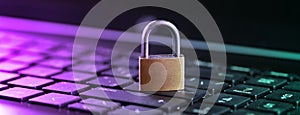 Cybersecurity concept, padlock on laptop computer keyboard