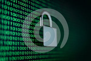 Cybersecurity concept with a padlock over binary code background.