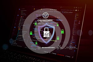 Cybersecurity and data protection concept with digital shield and lock icon over source code on laptop screen, representing secure