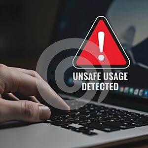Cybersecurity and Data Risk Concept: A Person Using a Computer with an Unsafe Usage Warning on the Screen