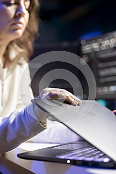 Programmer installing fortified code on notebook device