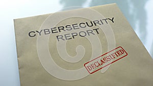 Cybersecurity report declassified, seal stamped on folder, important documents photo