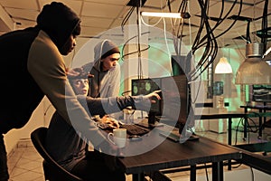 Cybersecurity specialists team fixing computer system cyberattack