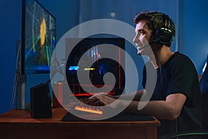 Cybersport pro gamer playing video game online photo