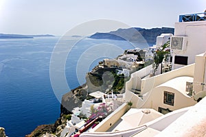 Cyclades architecture hotels houses over the caldera in oia santorini greek islands, greece, mediterranean sea view with mountains