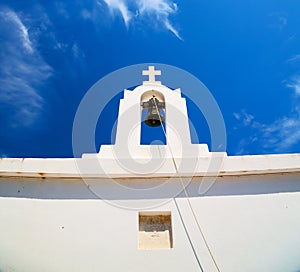 in cyclades europe greece a cross the cloudy sky and bell