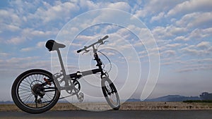 Cycle in the beach with blue sky background