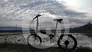 Cycle in the beach with blue sky background