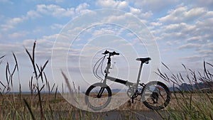 Cycle in the beach with blue sky background