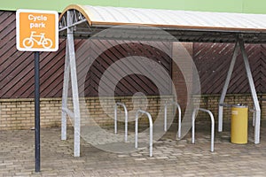 Cycle park ride storage secure rack shelter at place for workers people shoppers green environment healthy living lifestyle fitnes