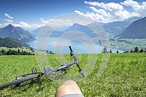 Cycler relaxes on top of Lake Lucerne photo