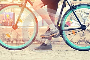 Cycler`s foot on pedal bicycle  in a park photo