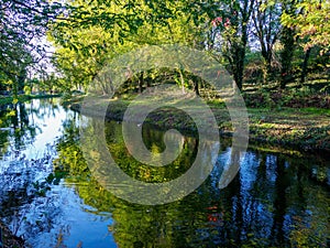 Cycleway along VIlloresi canal, Milan, Italy photo