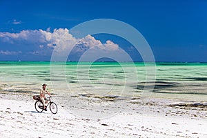 Cycling along tropical beach