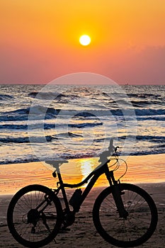 Cycling at the beach twilight time