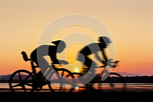 Cycling at the beach twilight time