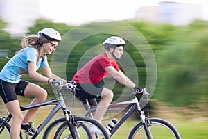 Cycling Concept: Young Caucasian Couple on Speedy Trip