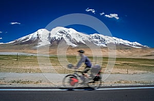 Cycling in front of Muztagh Ata