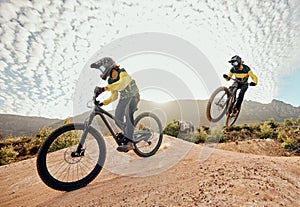 Cycling, mountain bike jump and man travel on dirt path for extreme sports adventure, journey or training for marathon