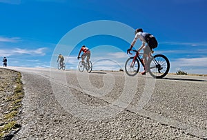 Cycling race on an uphill road in Ioannina, Greece, four bikers and bikes