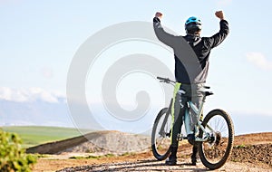 Cycling, sports and man celebrate on bicycle for winning on adventure, freedom and success. Mountain bike, nature and