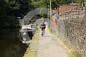 Cyclist on canal towpath photo