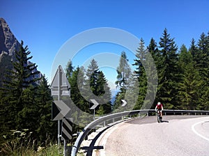 Cyclist climbing Alpe di Siusi