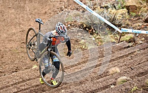 Cyclist climbing stairs at Cross Crusade 2016 in Bend Oregon