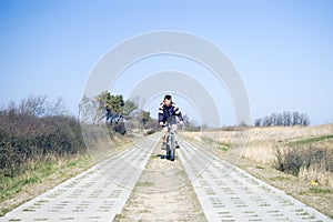 Cyclist on countryside track