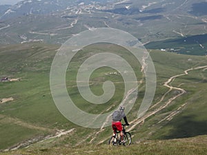 A cyclist defying the dangers of the Carpathian Mountains.