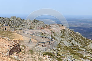 Cyclist descending the mountain road Pena de Francia, famous destination in Salamanca, Spain