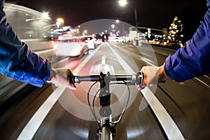 Cyclist drives on the bike path past the traffic jam