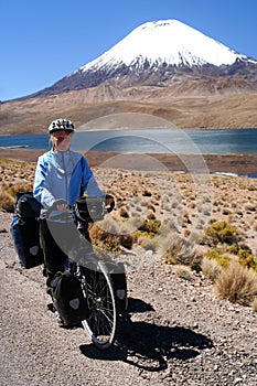 Cyclist in front of Parinacota volcano