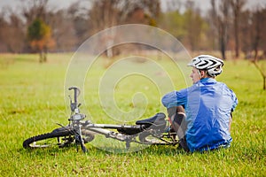 Cyclist have a rest with bike