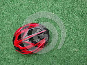 Cyclist helmet on artificial grass floor. Sports. Cycling photo