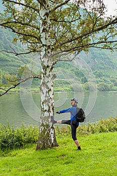 The cyclist in the helmet near the tree. Germany. Moselle