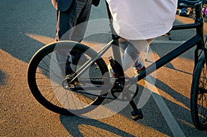 Cyclist and his bicycle at urban recreation