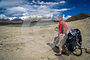 Cyclist at Kara Kul lake