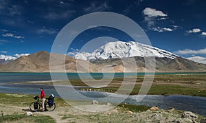 Cyclist at Kara Kul lake