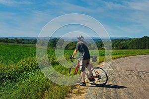 Cyclist Looking Over Wisconsin Cornfield